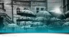 Umbrealla's along a black and white city in Ukraine